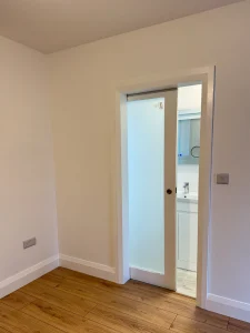 Door inside modular home leading to bathroom