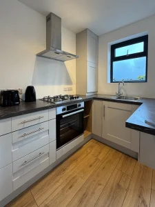 White, modern kitchen inside a modular home